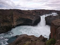 Aldeyjarfoss waterfall dropping between basalt columns in north Iceland