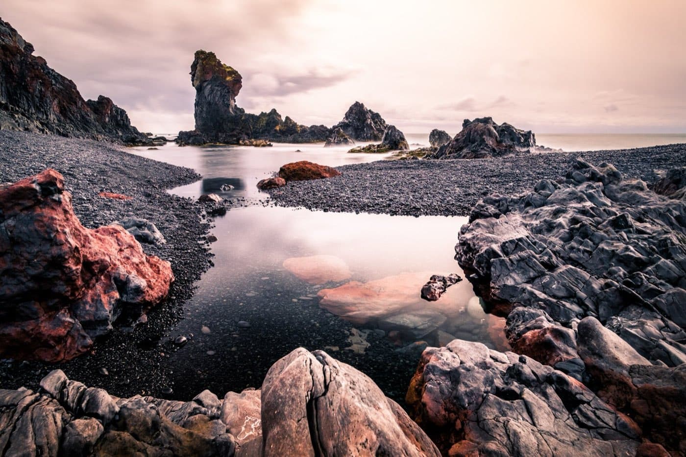 Black pebble beach and shipwreck remains at Djupalonssandur