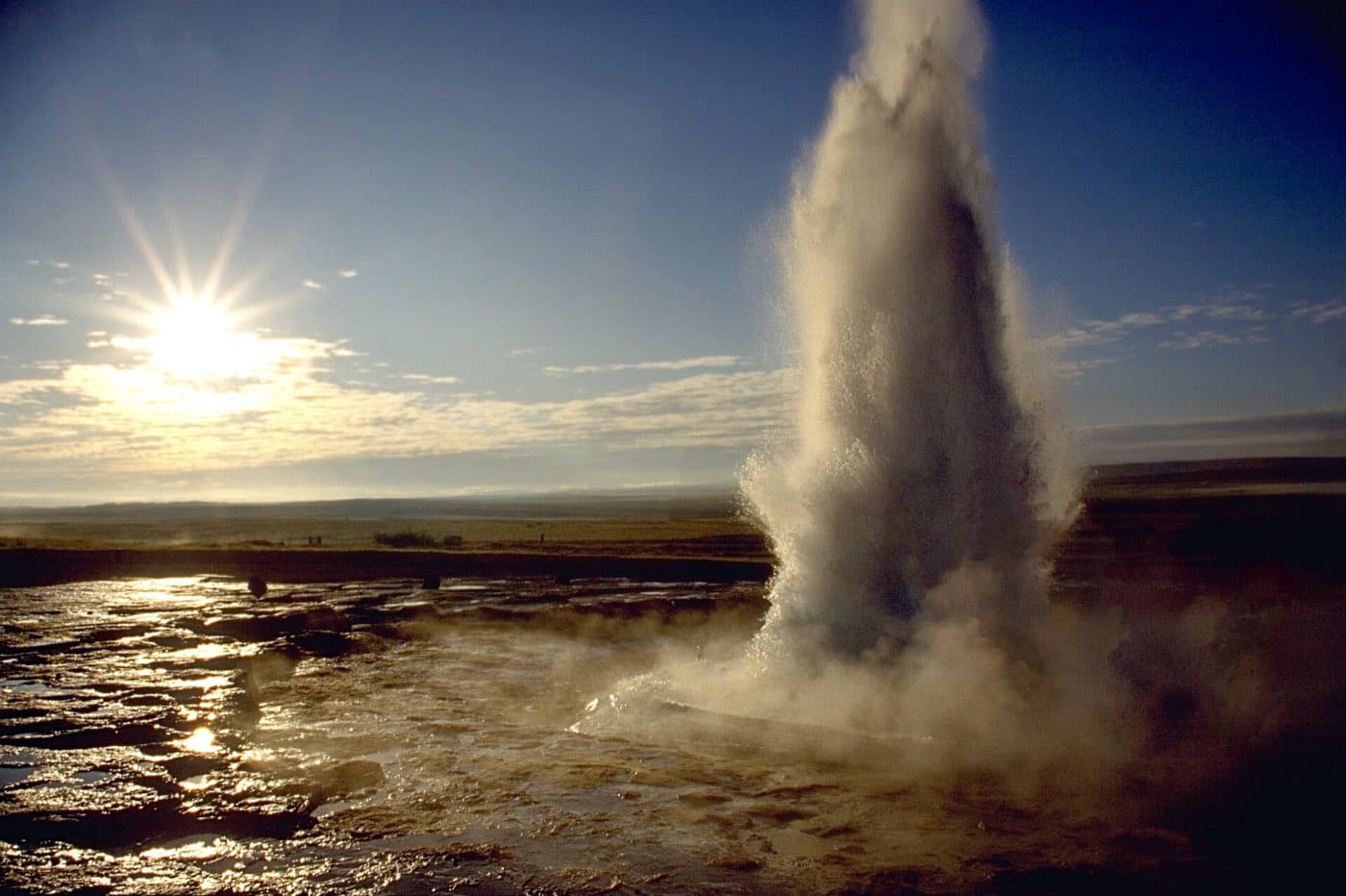 Strokkur erupting in a column of boiling water at the Geysir geothermal field