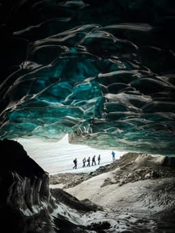 Blue ice walls inside a glacier ice cave
