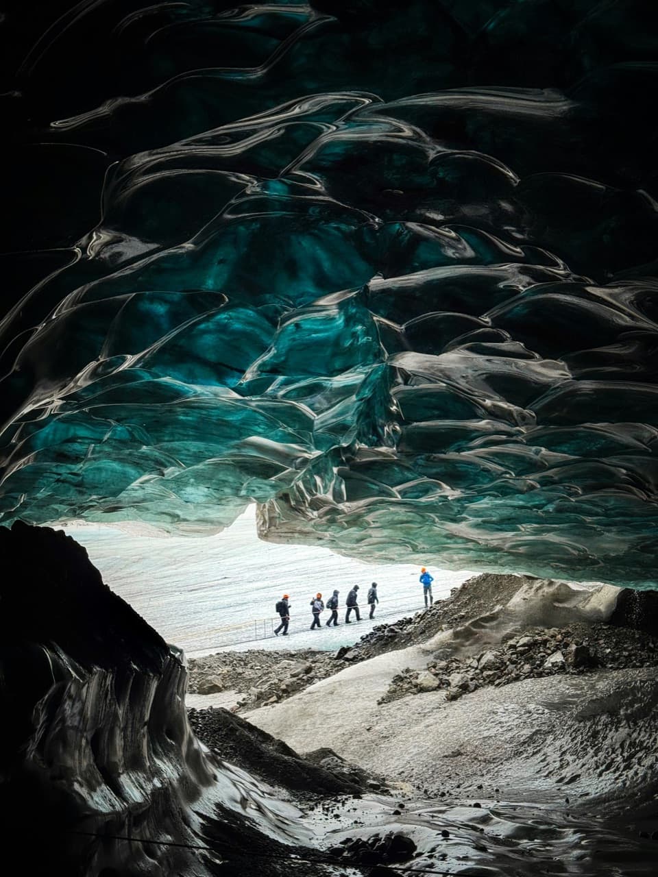 Blue ice walls inside a glacier ice cave