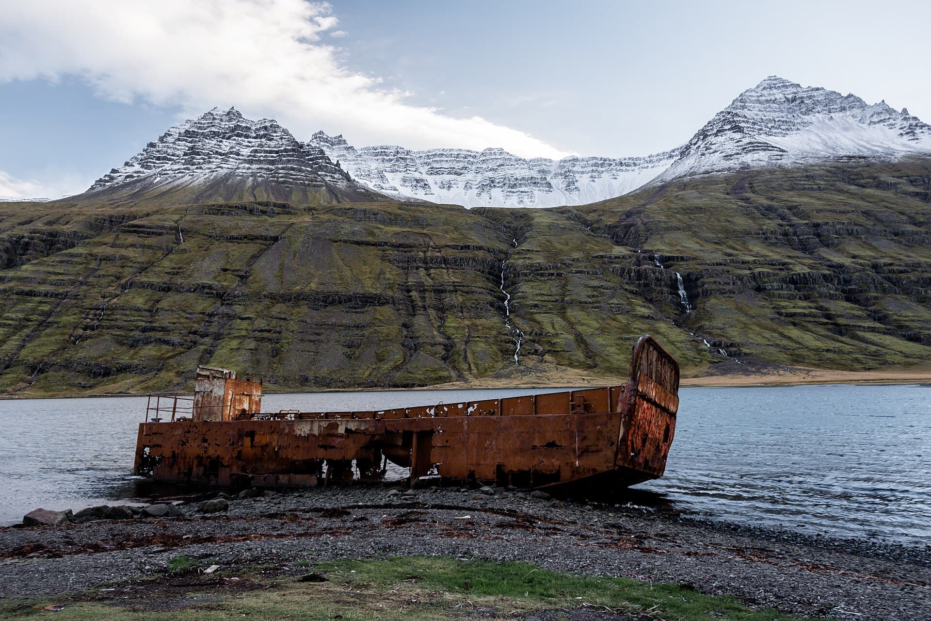 Mjoifjordur fjord and steep green mountains in east Iceland