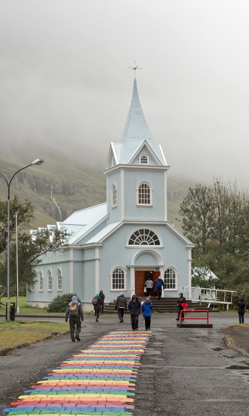 The blue church and rainbow street at Seydisfjordur in east Iceland
